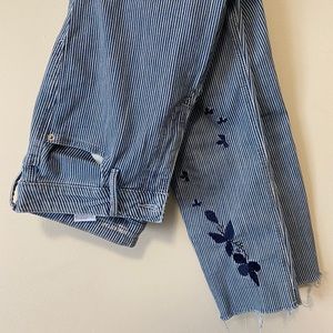 Striped jeans with flower pattern